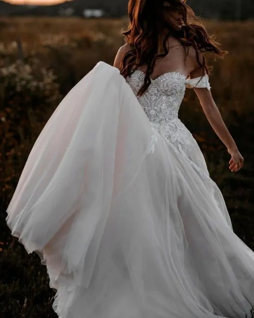 Luolandi A Line Tulle Off The Shoulder Floor Length Wedding Dresses With Lace & Pearls Sexy